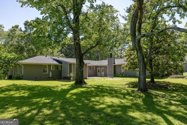 762 Rockbridge Rd NW, Lilburn, GA 30047 - view of front of property with a front lawn, crawl space, and a chimney
