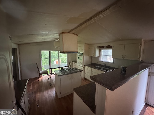 165 Twin Mountain Lake Rd, Talking Rock, GA 30175 - kitchen featuring gas stovetop, wood finished floors, a sink, dark countertops, and white cabinets