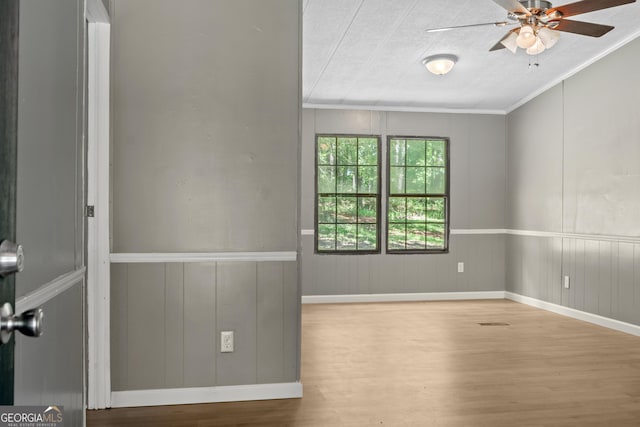 236 Overland Trl, Sparta, GA 31087 - spare room with wood finished floors, ceiling fan, and ornamental molding