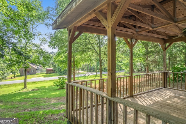 236 Overland Trl, Sparta, GA 31087 - wooden deck with a lawn and view of scattered trees