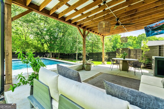 90 Middle St, Senoia, GA 30276 - fenced backyard featuring ceiling fan, outdoor lounge area, outdoor dining space, a patio, and view of scattered trees