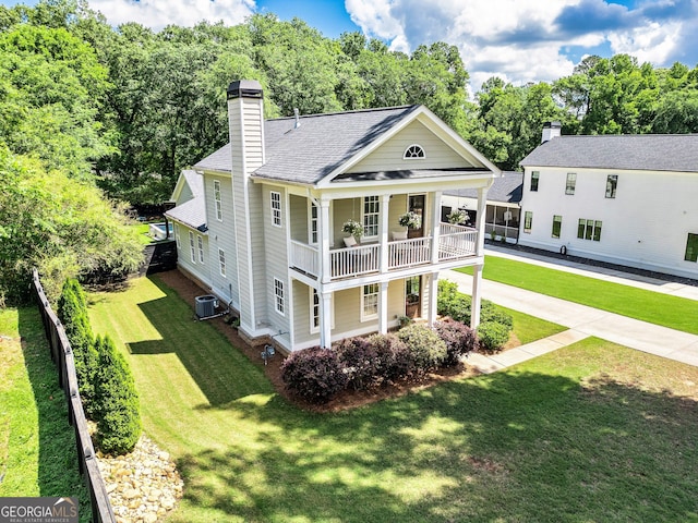 90 Middle St, Senoia, GA 30276 - view of front facade with a chimney, cooling unit, a balcony, a shingled roof, and a porch