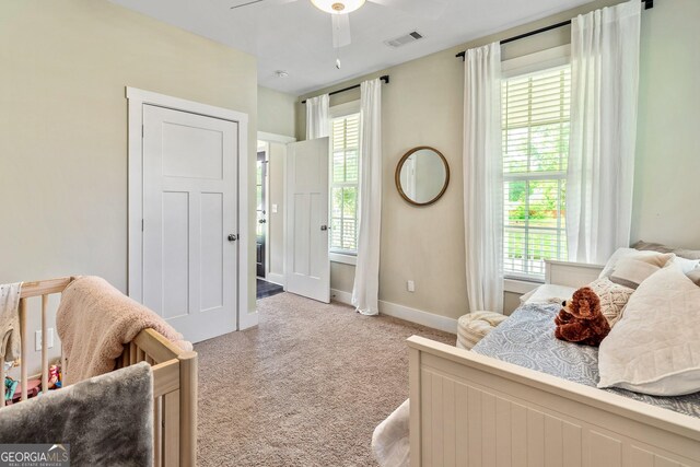 90 Middle St, Senoia, GA 30276 - bedroom with light colored carpet, baseboards, and a ceiling fan