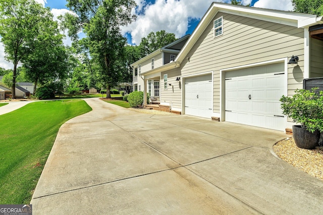 90 Middle St, Senoia, GA 30276 - view of side of property with driveway, a yard, and an attached garage