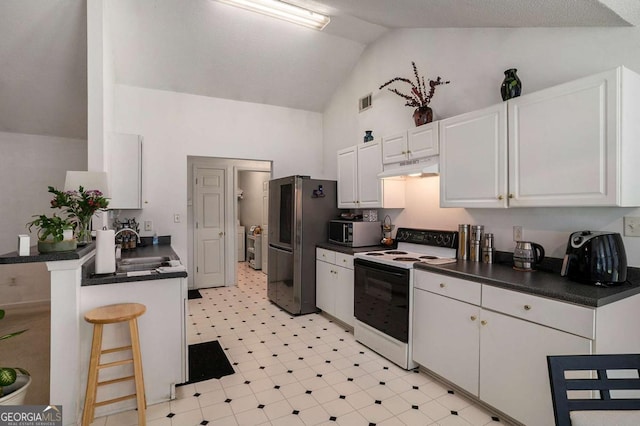 4378 Chestnut Oaks Trce, Lithonia, GA 30038 - kitchen featuring stainless steel appliances, dark countertops, under cabinet range hood, light flooring, and white cabinetry