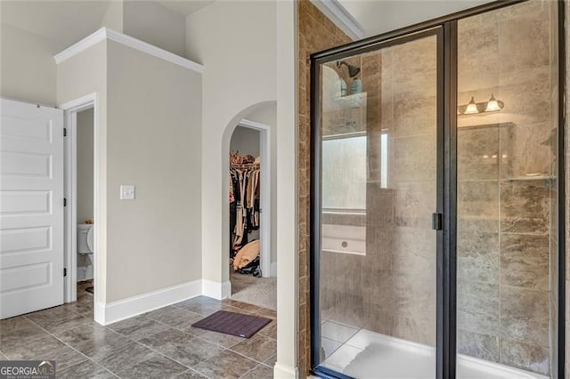 271 Learwood, Atlanta, GA 30349 - full bath with a stall shower, a walk in closet, baseboards, and toilet
