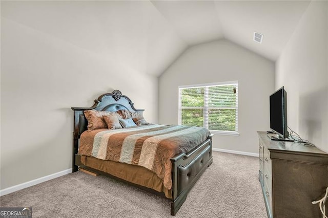 271 Learwood, Atlanta, GA 30349 - bedroom featuring vaulted ceiling, light carpet, and baseboards