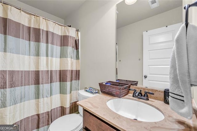 271 Learwood, Atlanta, GA 30349 - bathroom featuring toilet, vanity, and a shower with shower curtain