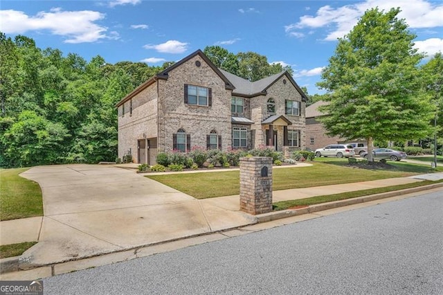 271 Learwood, Atlanta, GA 30349 - view of front facade with a front yard and brick siding