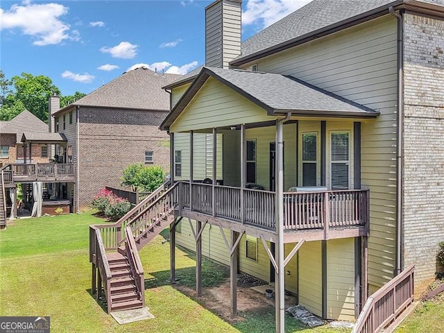 271 Learwood, Atlanta, GA 30349 - back of house featuring stairs, a lawn, a chimney, and a shingled roof