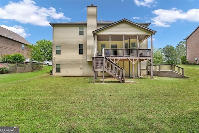 271 Learwood, Atlanta, GA 30349 - rear view of house featuring stairs, a sunroom, a deck, and a chimney