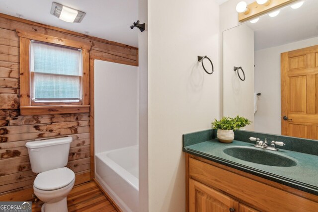 435 Ranch Mountan Dr, Dahlonega, GA 30533 - full bath with toilet, vanity, wooden walls, and wood finished floors