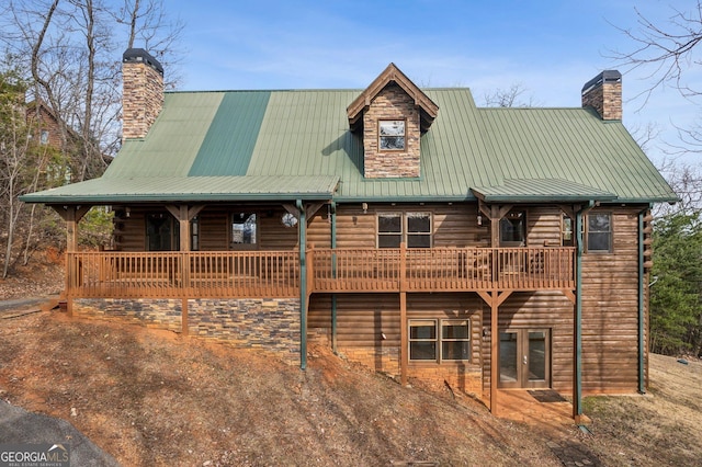 435 Ranch Mountan Dr, Dahlonega, GA 30533 - view of front of house featuring a chimney, metal roof, log exterior, and french doors