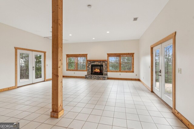 435 Ranch Mountan Dr, Dahlonega, GA 30533 - unfurnished living room featuring french doors, baseboards, a fireplace, recessed lighting, and light tile patterned floors