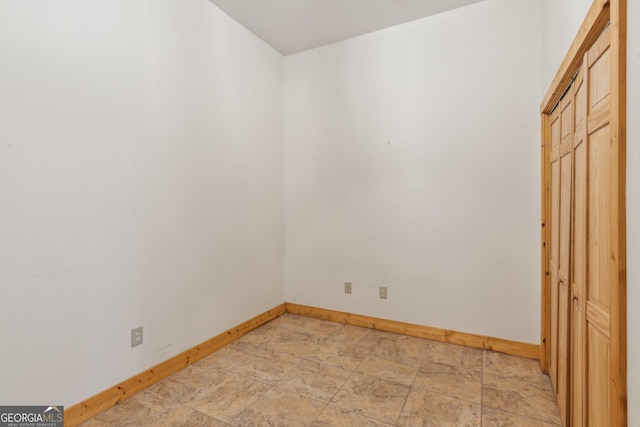 435 Ranch Mountan Dr, Dahlonega, GA 30533 - unfurnished bedroom with baseboards and light stone finish flooring