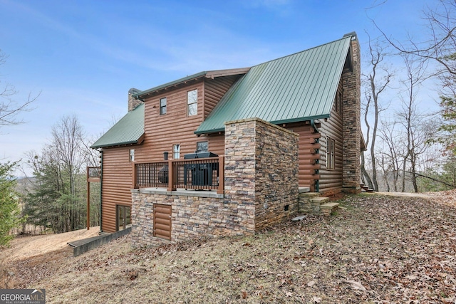 435 Ranch Mountan Dr, Dahlonega, GA 30533 - view of side of home featuring metal roof, a chimney, a balcony, and stone siding
