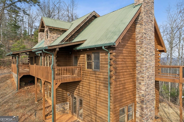 435 Ranch Mountan Dr, Dahlonega, GA 30533 - view of side of property with a chimney, log siding, metal roof, and a balcony