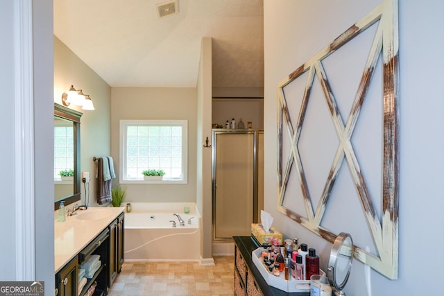 9013 Aldbury Dr, Locust Grove, GA 30248 - bathroom featuring a garden tub, vanity, and a stall shower