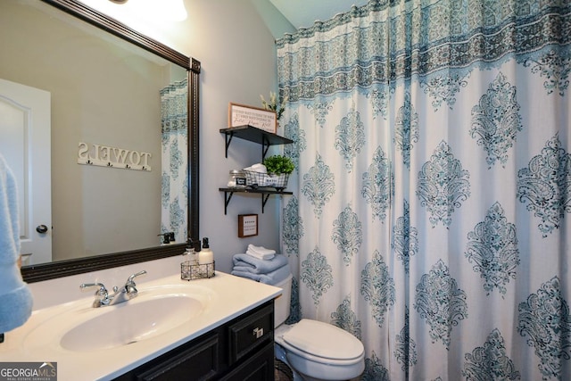 9013 Aldbury Dr, Locust Grove, GA 30248 - bathroom with vanity, toilet, and a shower with curtain