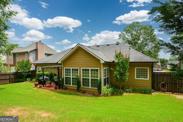 9013 Aldbury Dr, Locust Grove, GA 30248 - back of house with a patio and a shingled roof