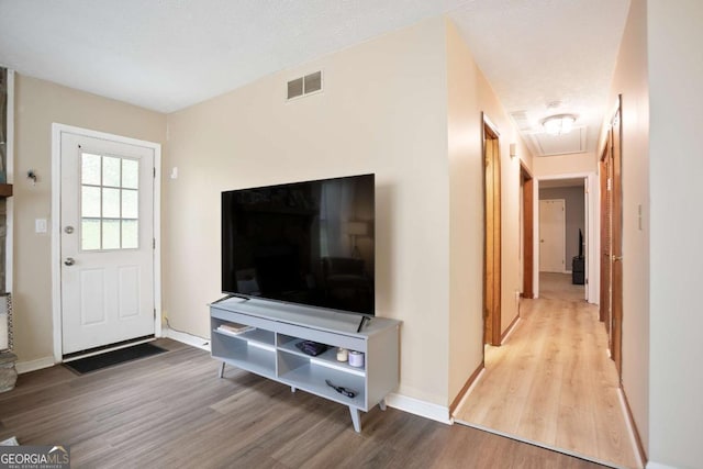 189 Timber Creek Ln, Marietta, GA 30060 - unfurnished living room with wood finished floors, attic access, and baseboards
