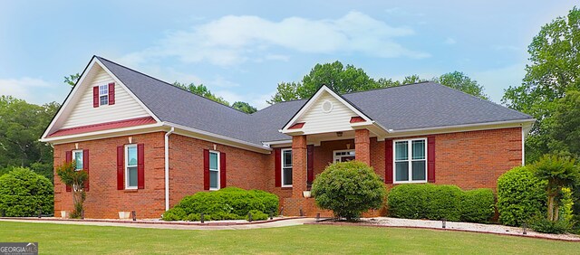 4684 Martins Crossing W Dr, Flowery Branch, GA 30542 - view of front of house featuring brick siding and a front lawn