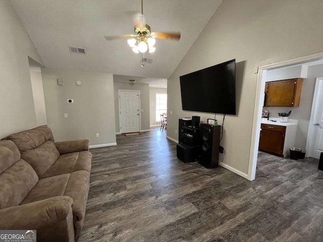 43 Fabian Ln, Hinesville, GA 31313 - living area with dark wood-style floors, a ceiling fan, baseboards, and high vaulted ceiling