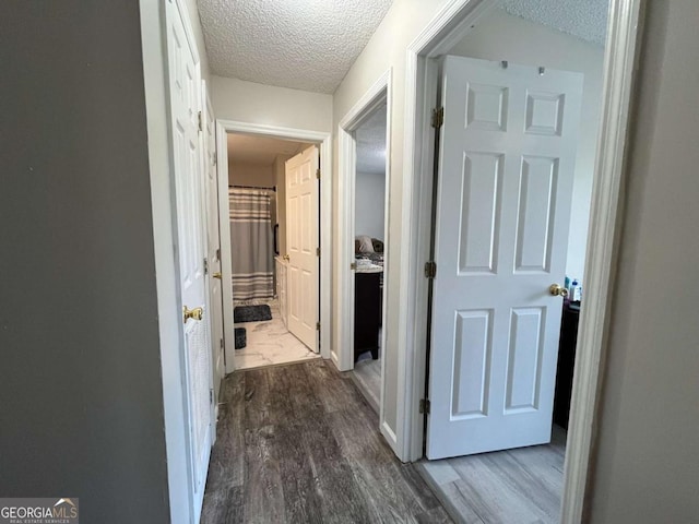 43 Fabian Ln, Hinesville, GA 31313 - hall with a textured ceiling and dark wood-type flooring