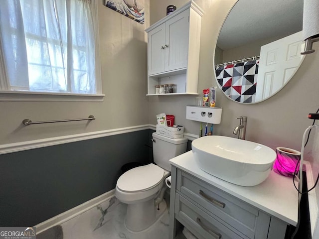 43 Fabian Ln, Hinesville, GA 31313 - full bath featuring toilet, vanity, baseboards, and marble look tile flooring