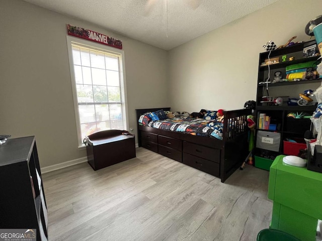 43 Fabian Ln, Hinesville, GA 31313 - bedroom with wood finished floors and a textured ceiling