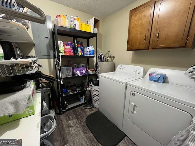 43 Fabian Ln, Hinesville, GA 31313 - laundry room featuring cabinet space, washing machine and clothes dryer, dark wood-type flooring, electric panel, and a textured ceiling
