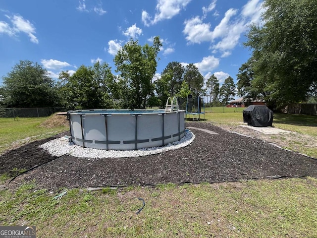 43 Fabian Ln, Hinesville, GA 31313 - view of yard with a trampoline
