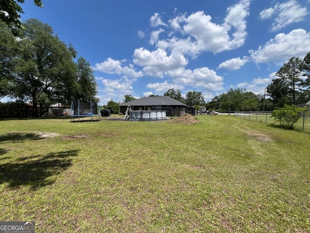43 Fabian Ln, Hinesville, GA 31313 - view of yard with a trampoline