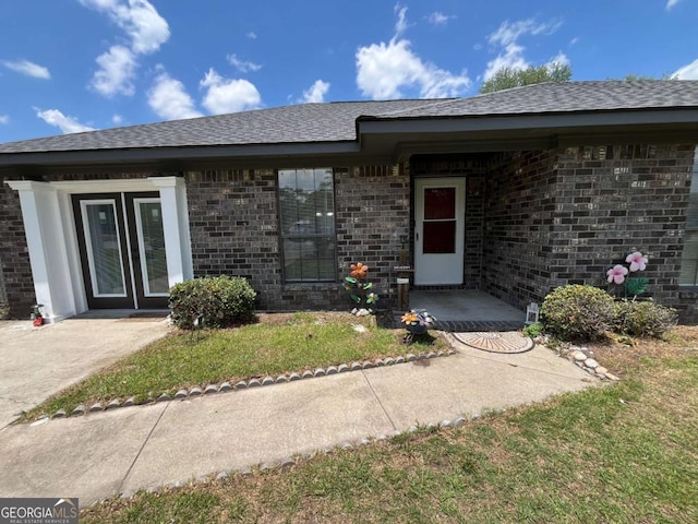 43 Fabian Ln, Hinesville, GA 31313 - entrance to property featuring brick siding and roof with shingles