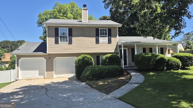 6120 Raleigh Oaks Ct, Lithonia, GA 30058 - tri-level home featuring driveway, a chimney, and an attached garage