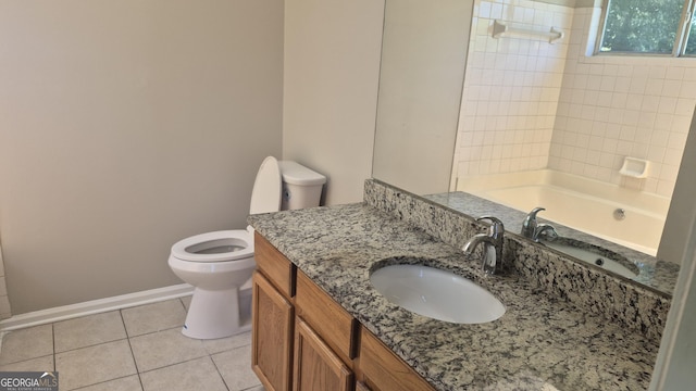 6120 Raleigh Oaks Ct, Lithonia, GA 30058 - bathroom featuring toilet, tile patterned floors, vanity, baseboards, and tub / shower combination