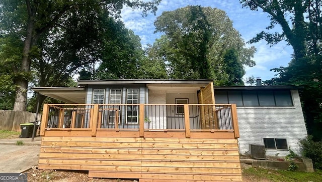 6072 Holiday Blvd, Forest Park, GA 30297 - back of house featuring a deck and central air condition unit