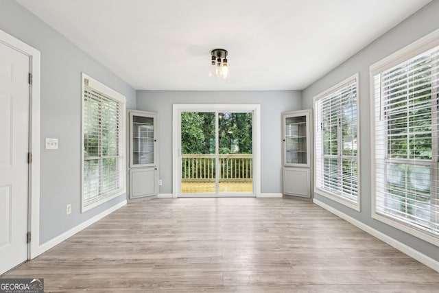 6072 Holiday Blvd, Forest Park, GA 30297 - unfurnished sunroom featuring healthy amount of natural light
