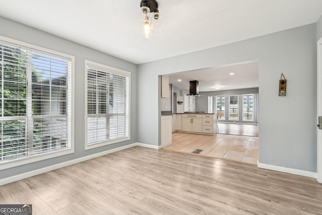 6072 Holiday Blvd, Forest Park, GA 30297 - unfurnished living room featuring light wood-style floors, baseboards, and recessed lighting