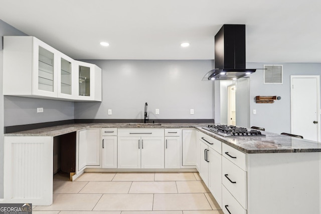 6072 Holiday Blvd, Forest Park, GA 30297 - kitchen with a sink, island exhaust hood, stainless steel gas cooktop, a peninsula, and stone countertops