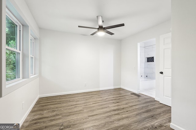 6072 Holiday Blvd, Forest Park, GA 30297 - spare room featuring ceiling fan, wood finished floors, and baseboards