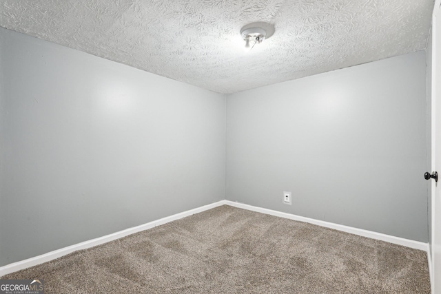 6072 Holiday Blvd, Forest Park, GA 30297 - spare room featuring carpet floors, a textured ceiling, and baseboards