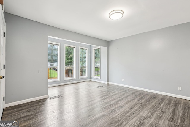 6072 Holiday Blvd, Forest Park, GA 30297 - spare room with wood finished floors and baseboards