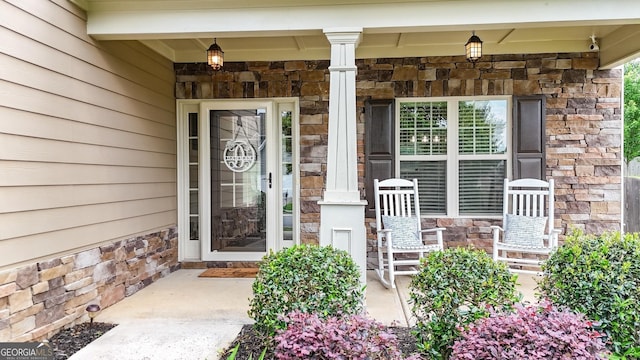 18 Crown Dr, Dallas, GA 30132 - entrance to property featuring stone siding and a porch