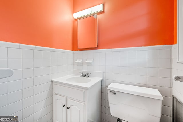 136 Briarwood Dr, Toccoa, GA 30577 - bathroom with tile walls, vanity, toilet, and wainscoting