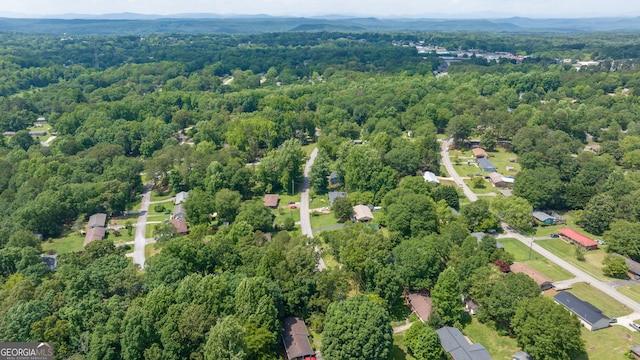 136 Briarwood Dr, Toccoa, GA 30577 - aerial view of property and surrounding area featuring a heavily wooded area and a mountain backdrop