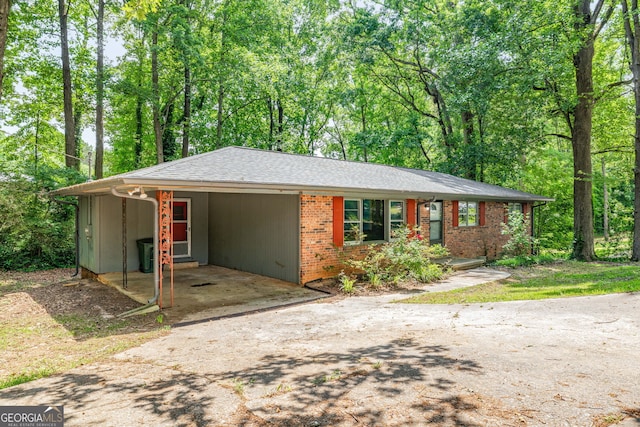 136 Briarwood Dr, Toccoa, GA 30577 - single story home with concrete driveway, an attached carport, and brick siding