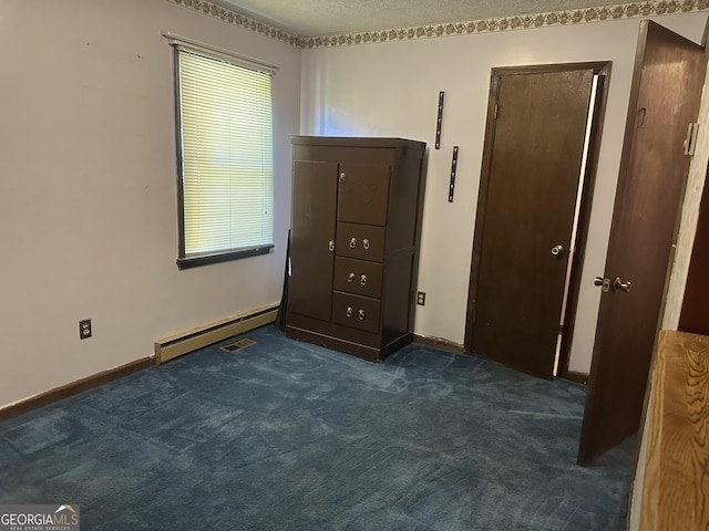 421 Chase Cir, Cornelia, GA 30531 - unfurnished bedroom featuring a baseboard radiator, dark carpet, and baseboards
