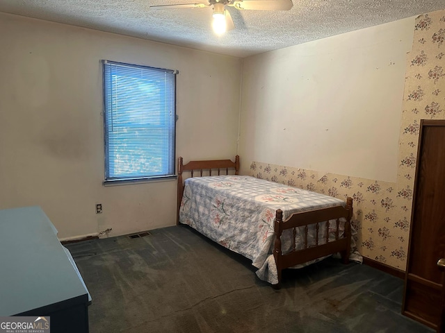 421 Chase Cir, Cornelia, GA 30531 - carpeted bedroom with a textured ceiling, wallpapered walls, and ceiling fan