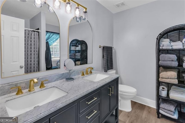 333 Ivy Hills Cir, Mount Airy, GA 30563 - bathroom featuring double vanity, wood finished floors, and curtained shower